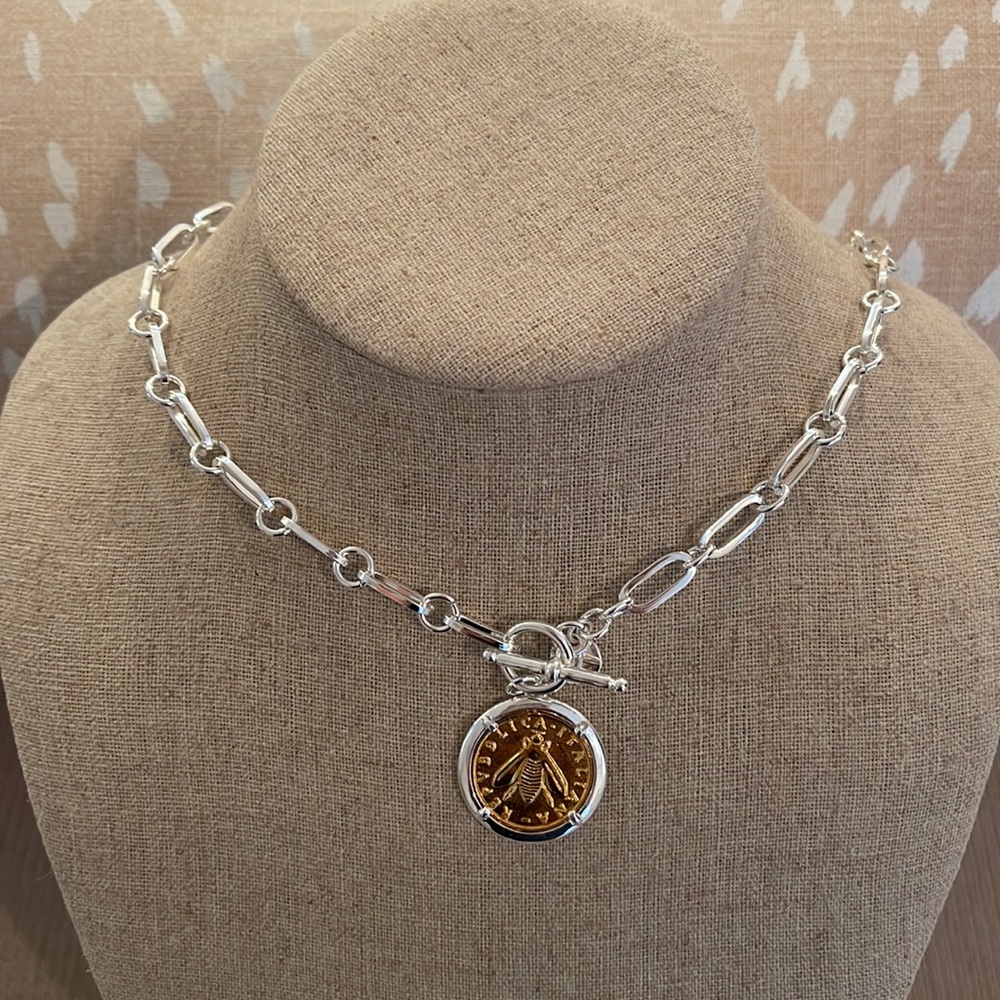 Silver and gold colored toggle necklace. Stamped Bronze Italy